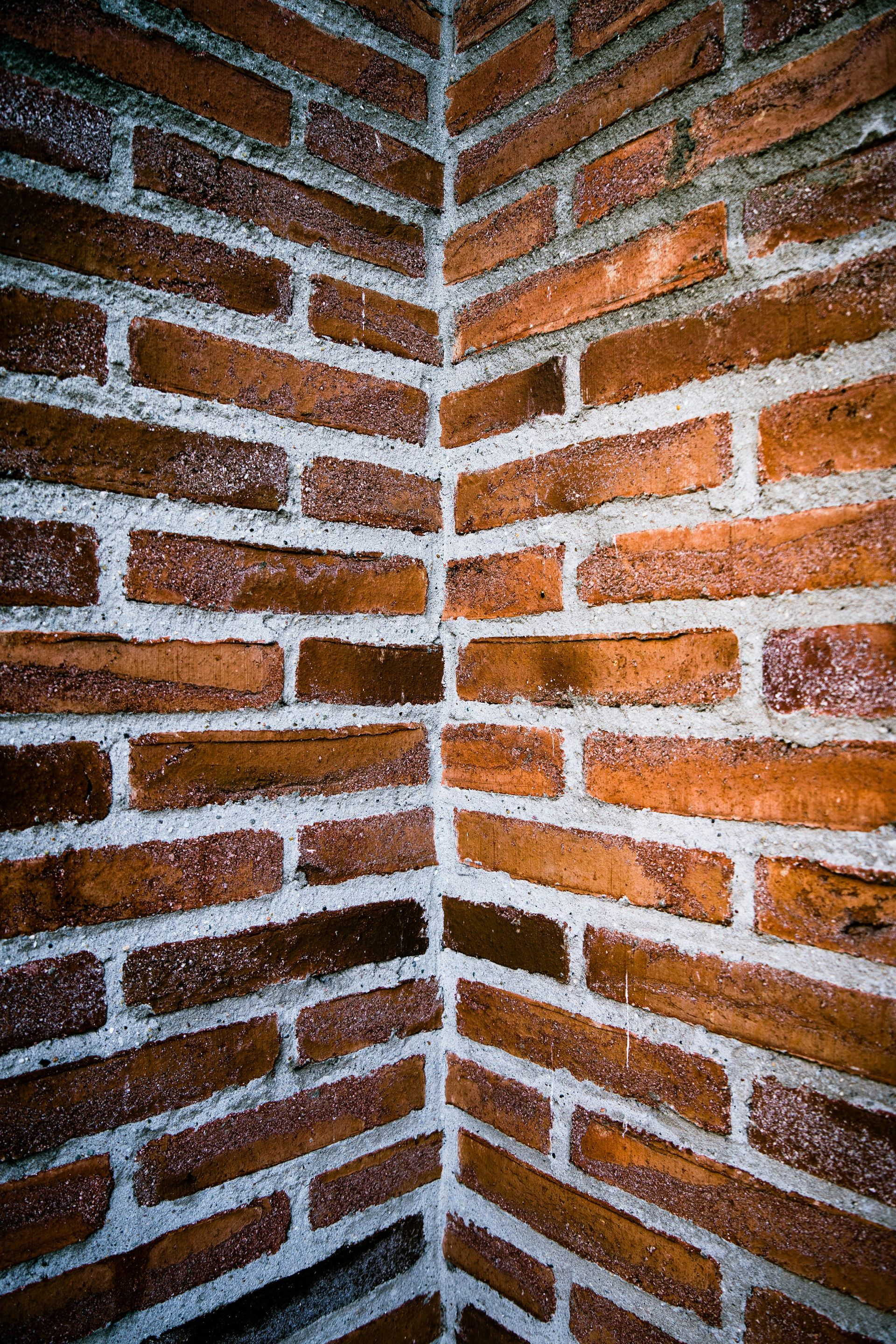 brown brick wall during daytime
