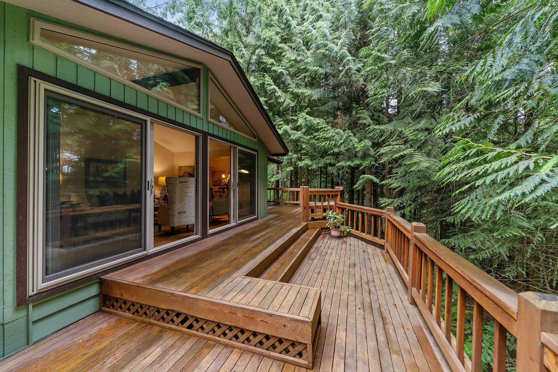 brown wooden terrace outside clear glass door